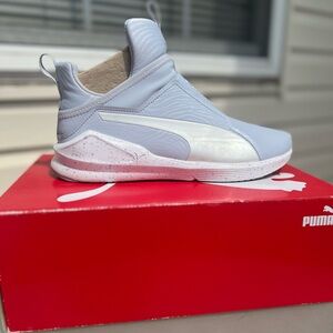 Blue and white Puma sneakers